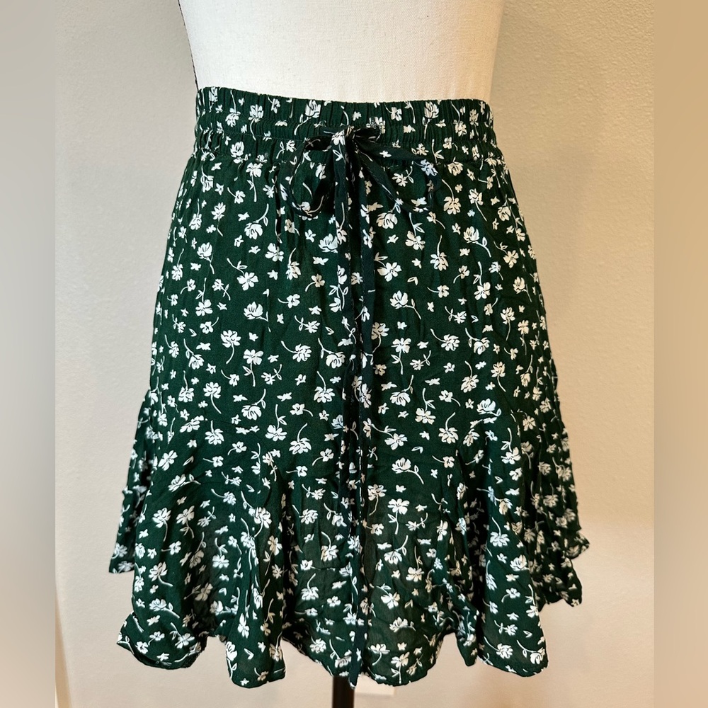 Princess Polly green floral mini skirt with bow at waist
